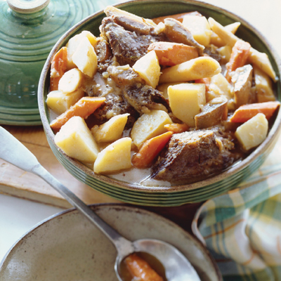 Beef Stew in a Soup Tureen; Spoon with Carrots and Potato in a Bowl